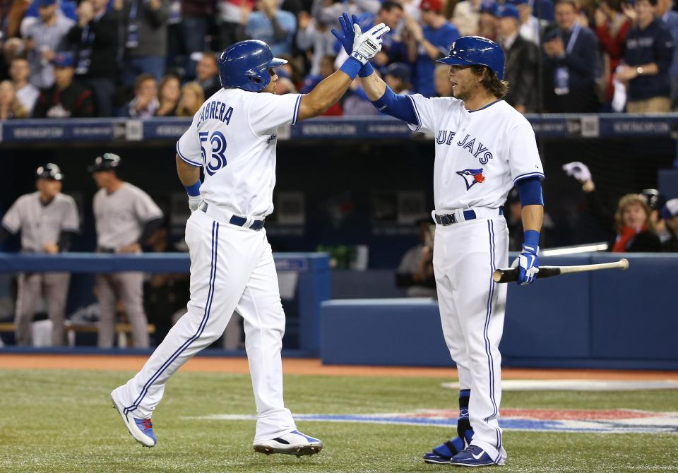 Melky Cabrera, left, and Colby Rasmus are free agents at the end of the 2014 season. (Tom Szczerbowski/Getty Images)