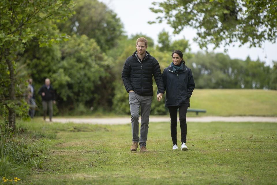 Prince Harry and Meghan Markle stroll through greenery together