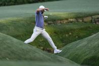 Scottie Scheffler keeps over Rae's Creek on the 13th hole during second round at the Masters golf tournament at Augusta National Golf Club Friday, April 12, 2024, in Augusta, Ga. (AP Photo/David J. Phillip)