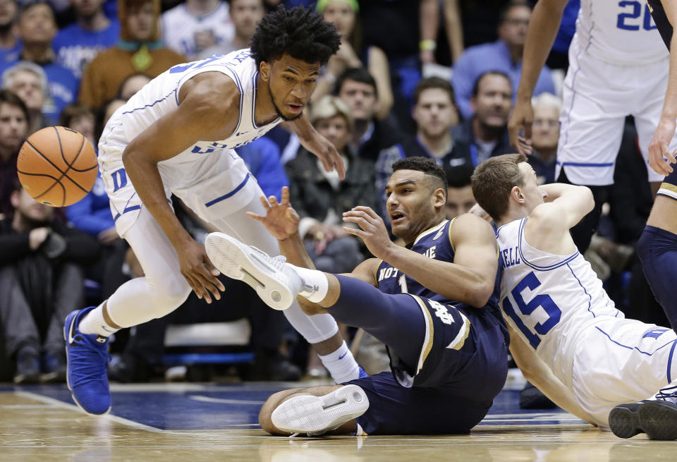 Duke’s Marvin Bagley III, left, and Alex O’Connell (15) chase the ball with Notre Dame’s Austin Torres during the first half of an NCAA college basketball game in Durham, N.C., Monday, Jan. 29, 2018. (AP Photo/Gerry Broome)