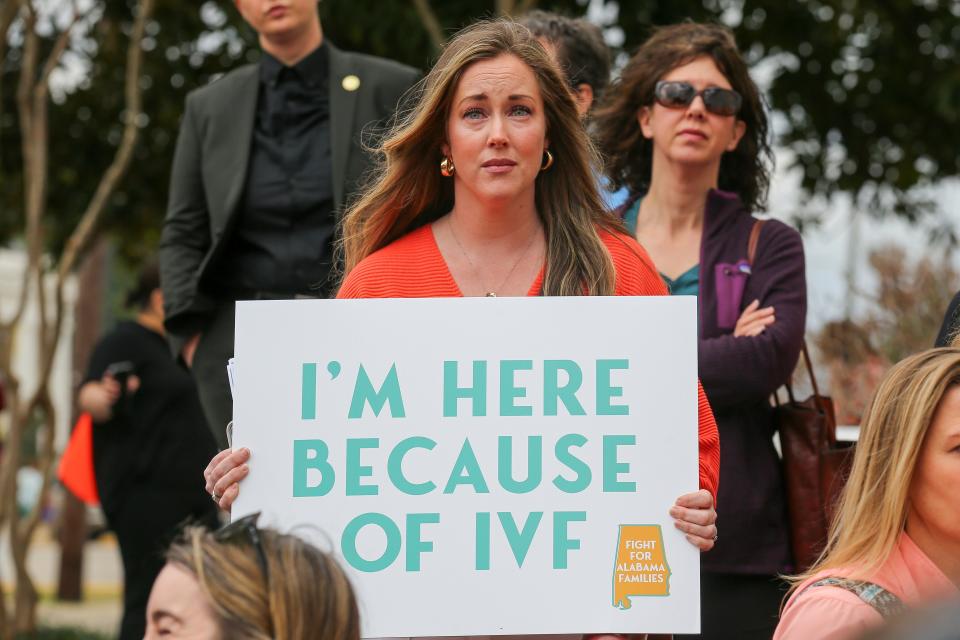 Sarah Brown, from Birmingham, Ala., holds a sign in support of IVF treatments during a rally advocating for IVF rights outside the Alabama State House. Brown has two children who were each conceived using IVF at Birmingham Fertility center. (Stew Milne/AP)