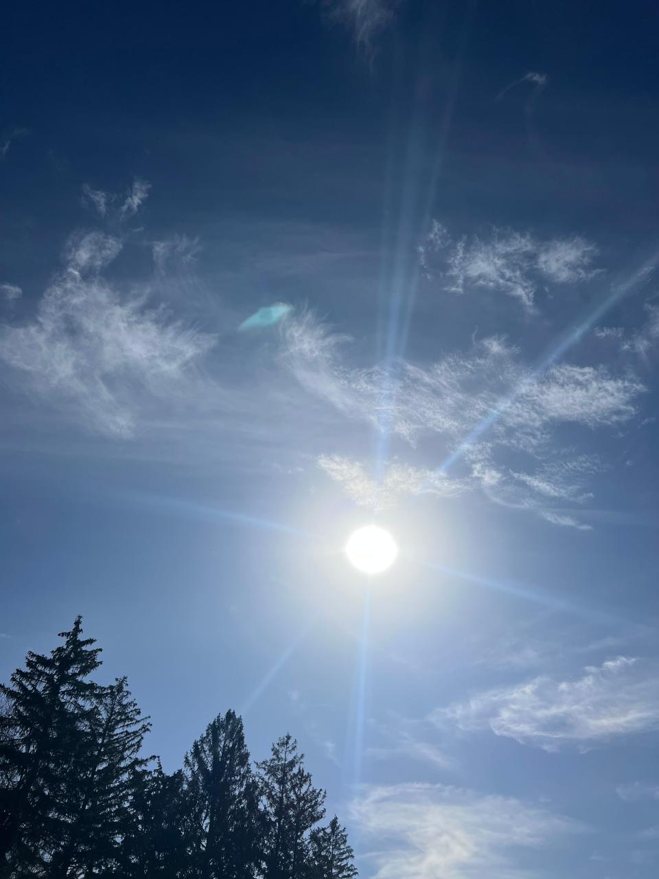 The sun shines over trees in the Muncie, Ind., area. According to Healthline, UV exposure increases serotonin, which combats depression, one of the most prominent issues schools are seeing in students.