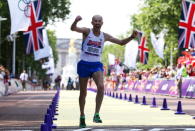 LONDON, ENGLAND - AUGUST 11: Sergey Kirdyapkin of Russia crosses the line to win gold during the Men's 50km Walk on Day 15 of the London 2012 Olympic Games on the streets of London on August 11, 2012 in London, England. (Photo by Streeter Lecka/Getty Images)