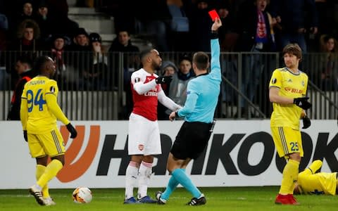 Arsenal's Alexandre Lacazette is shown a red card by referee Srdjan Jovanovic - Credit: REUTERS