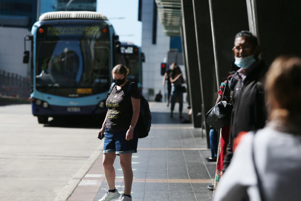 People in Sydney wearing face masks. Source: Getty