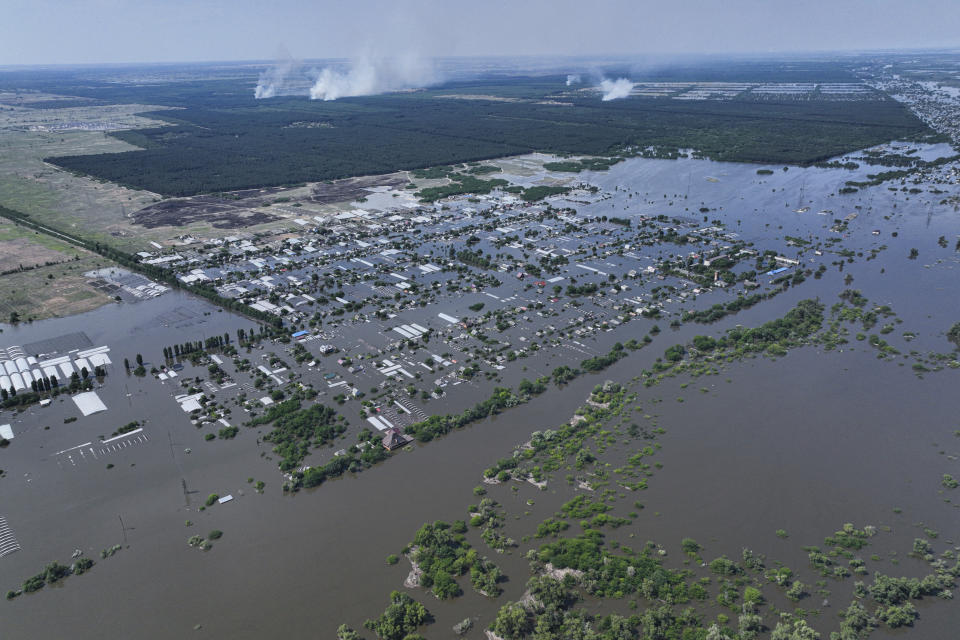 CAPTION CORRECTS LOCATION - Houses are seen underwater in the flooded village of Dnipryany, in Russian-occupied Ukraine, Wednesday, June 7, 2023, after the collapse of Kakhovka Dam. (AP Photo)