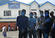 People wearing face masks as a precautionary measure against the coronavirus wait to test for COVID-19 in Kohima, capital of the northeastern Indian state of Nagaland, Saturday, Oct. 10, 2020. India’s total coronavirus positive cases near 7 million with another 73,272 infections reported in the past 24 hours. The Health Ministry on Saturday put the total positive caseload at 6.97 million, second to 7.66 million infections registered in the worst-hit United States. (AP Photo/Yirmiyan Arthur)