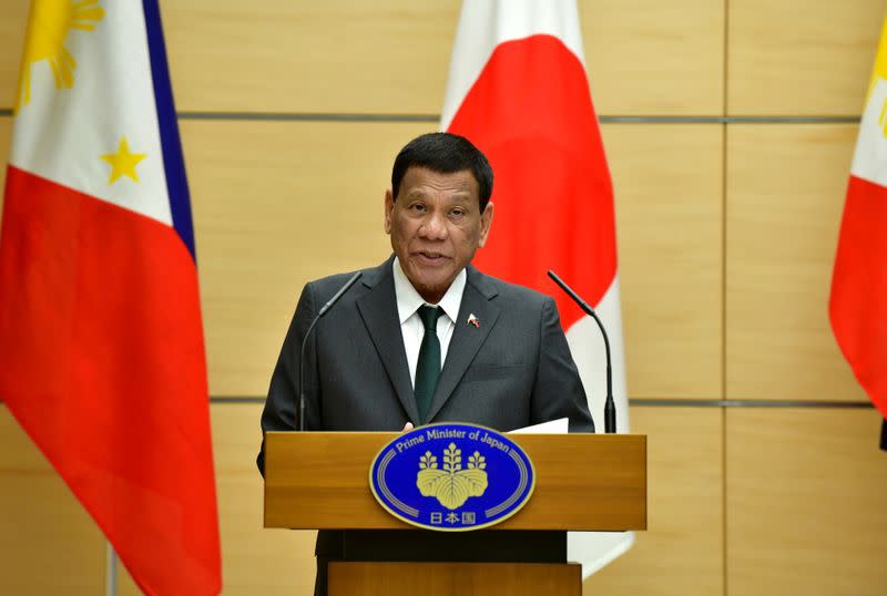 FILE PHOTO: Philippine President Rodrigo Duterte delivers a speech during their joint press statement with Japan's Prime Minister Shinzo Abe in Tokyo