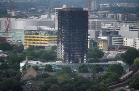 The burnt out remains of the Grenfell apartment tower are seen in North Kensington, London, Britain, June 29, 2017. REUTERS/Hannah McKay -