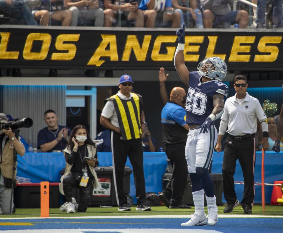 Cowboys running back Tony Pollard celebrates a touchdown against the Chargers.