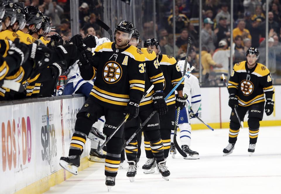 <p>
              Boston Bruins' Patrice Bergeron is congratulated by teammates on the bench after scoring against the Toronto Maple Leafs during the first period of an NHL hockey game Saturday, Nov. 10, 2018, in Boston. (AP Photo/Winslow Townson)
            </p>