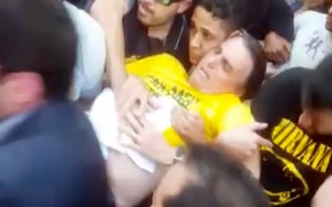  In this video still provided by Fernando Goncalves, National Social Liberal Party presidential candidate Jair Bolsonaro is carried away after being stabbed  - Credit: AP