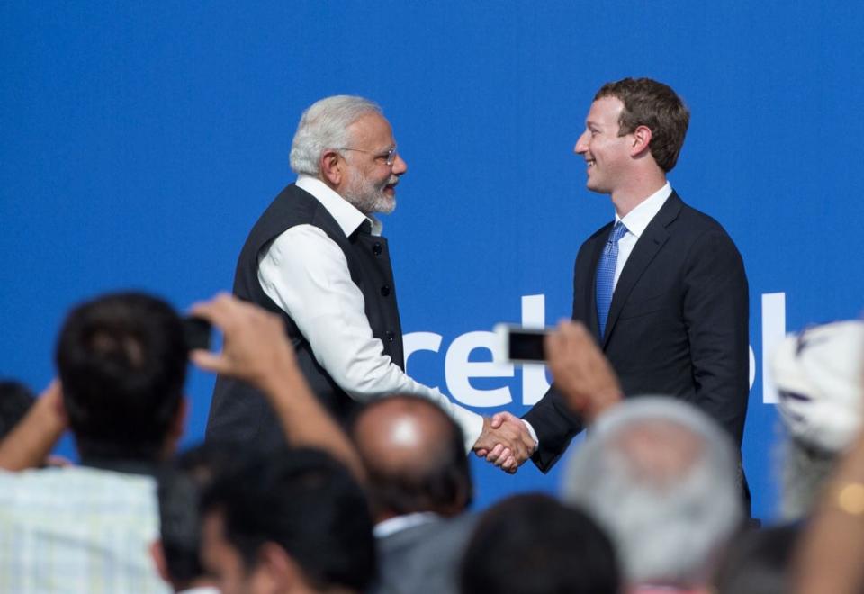 Indian Prime Minister Narendra Modi (L) and Facebook CEO Mark Zuckerberg shake hands after a Townhall meeting, at Facebook headquarters (AFP via Getty Images)