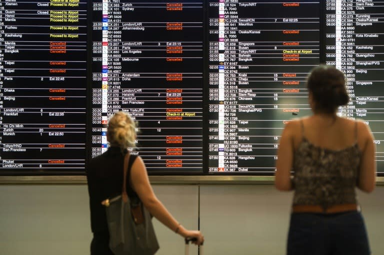 Authorities issued an amber alert to signal heavy rain on Tuesday morning leaving many people stranded at the airport as hundreds of flights were cancelled. (Photo by: AFP)