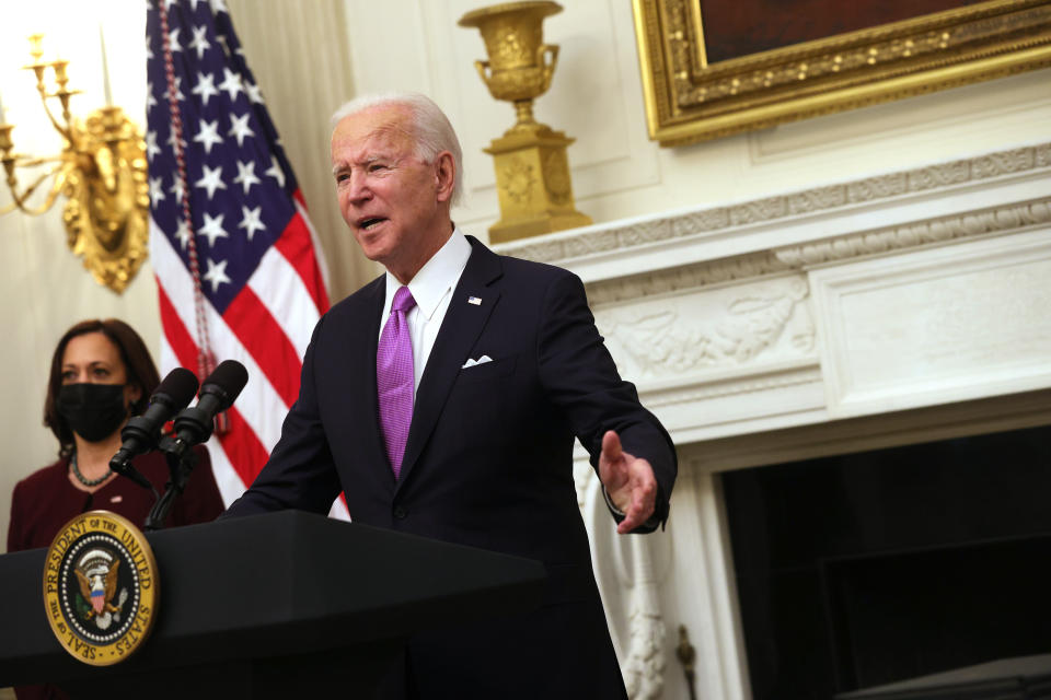 WASHINGTON, DC - JANUARY 21: U.S. President Joe Biden speaks as Vice President Kamala Harris looks on during an event at the State Dining Room of the White House January 21, 2021 in Washington, DC. President Biden delivered remarks on his administration’s COVID-19 response, and signed executive orders and other presidential actions. (Photo by Alex Wong/Getty Images)