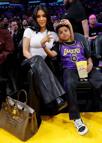 <p>Kevork Djansezian/Getty</p> Kim Kardashian and Saint West attend a basketball game between the Los Angeles Lakers and Golden State Warriors at Crypto.com Arena on March 16