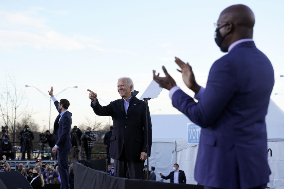 President-elect Joe Biden campaigns in Atlanta, Monday, Jan. 4, 2021, for Senate candidates Raphael Warnock, right, and Jon Ossoff, left. (AP Photo/Carolyn Kaster)