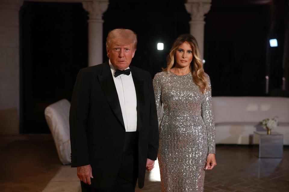Former President Donald Trump and former first lady Melania Trump arrive for a New Years event at his Mar-a-Lago home on Dec. 31 in Palm Beach, Florida.
