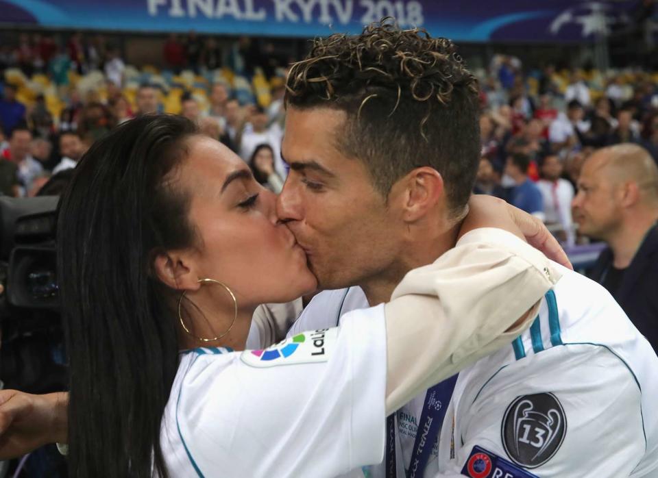 Cristiano Ronaldo of Real Madrid celebrates with Georgina Rodriguez following his sides victory in the UEFA Champions League Final between Real Madrid and Liverpool at NSC Olimpiyskiy Stadium on May 26, 2018 in Kiev, Ukraine