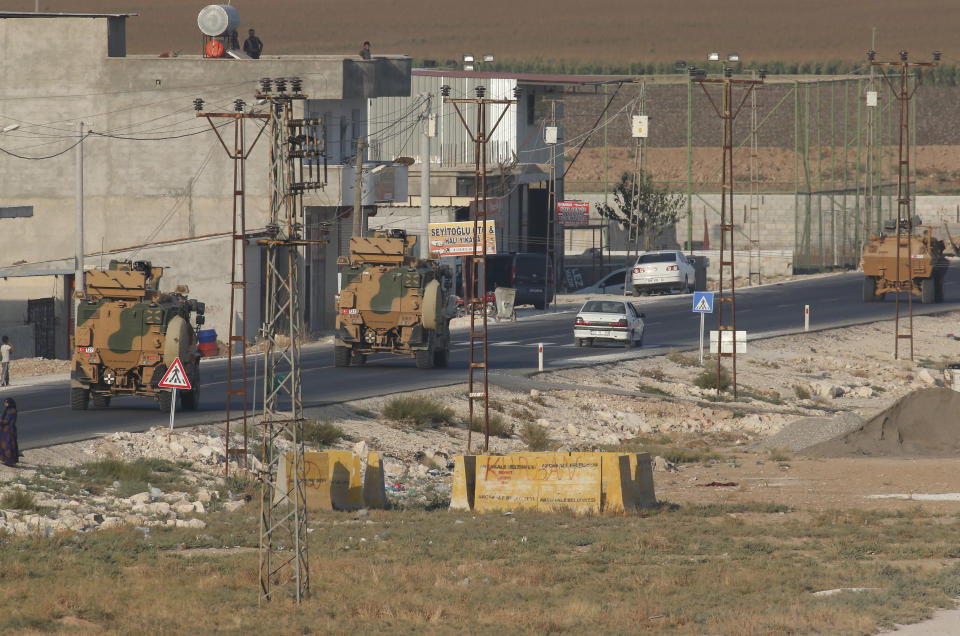 Shortly after the Turkish operation inside Syria had started,a convoy of Turkish forces vehicles is driven through the town of Akcakale, Sanliurfa province, southeastern Turkey, at the border between Turkey and Syria, Wednesday, Oct. 9, 2019. Turkey launched a military operation Wednesday against Kurdish fighters in northeastern Syria after U.S. forces pulled back from the area, with a series of airstrikes hitting a town on Syria's northern border.(AP Photo/Lefteris Pitarakis)