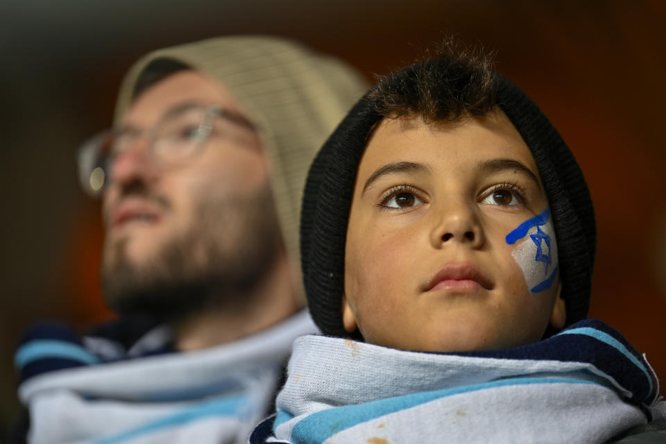 Israel fans support their team prior the Euro 2024 group I qualifying soccer match between Israel and Romania at the Pancho Arena in Felcsut, Hungary, Saturday, Nov. 18, 2023. (AP Photo/Denes Erdos)