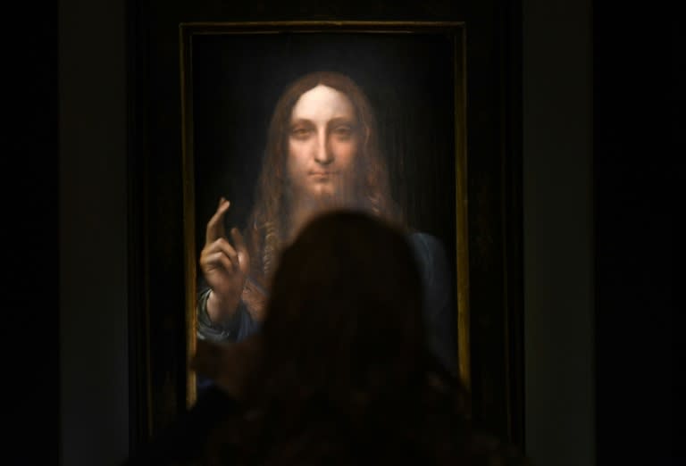 (FILES): This file photo taken on November 03, 2017 shows Leonardo da Vinci’s "Salvator Mundi" on display at Christie's New York during a press preview for the Post-War & Contemporary Art Evening Sale to be held November 15, 2017. A 500-year-old work of art depicting Jesus Christ, believed to be the work of Renaissance master Leonardo da Vinci, sold in New York on Wednesday, November 15, 2017 for $450.3 million setting a new art auction record, Christie's said