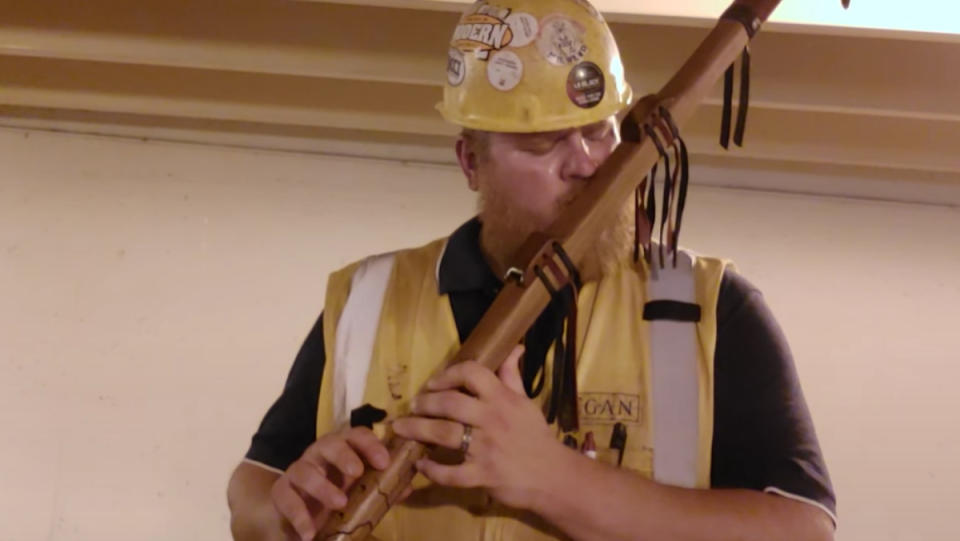 Paul Harvey the Flute Guy playing "A Walking Song" on his flute inside of a parking garage.