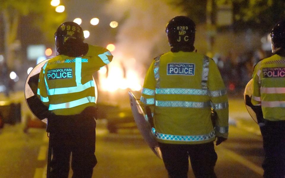 Police officers on Romford Road in Forest Gate, east London, as people protest over the death of Edir Frederico Da Costa - Credit: Lauren Hurley/PA