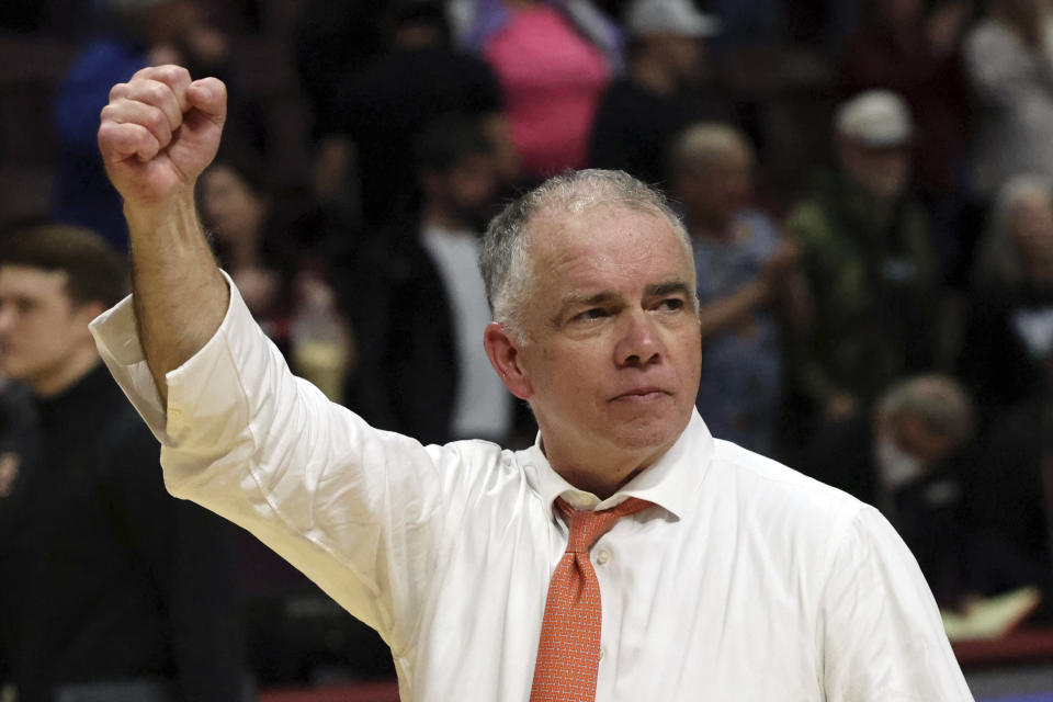 Virginia Tech coach Mike Young clenches his fist after the team's win over Boston College in an NCAA college basketball game Tuesday, Jan. 23, 2024, in Blacksburg, Va. (Matt Gentry/The Roanoke Times via AP)