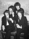 <p>Like most bands that rose to fame in the 60s, The Beatles changed their hair a number of times over the decades. But it was their heavy fringes – and equally heavy sideburns – that the foursome sported when they received their OBEs from the Queen in the mid-60s. [Photo: PA] </p>