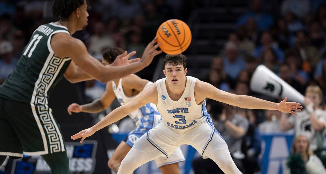 North Carolina’s Cormac Ryan (3) defends Michigan State’s A.J. Hoggard (11) in the second half on Saturday, March 23, 2024, during the second round of the NCAA Tournament at Spectrum Center in Charlotte, N.C.