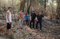 Indigenous Australians Oliver Costello, Jacob Morris and Vanessa Cavanagh speak with Yukon first nation firemen, Jordan Profeit and Chad Thomas in a forest in Illaroo