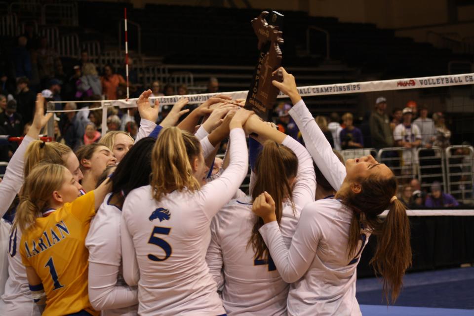 Birmingham Marian celebrates its Division 1 state volleyball title win over Northville on Saturday, Nov. 19, 2022, in Battle Creek.