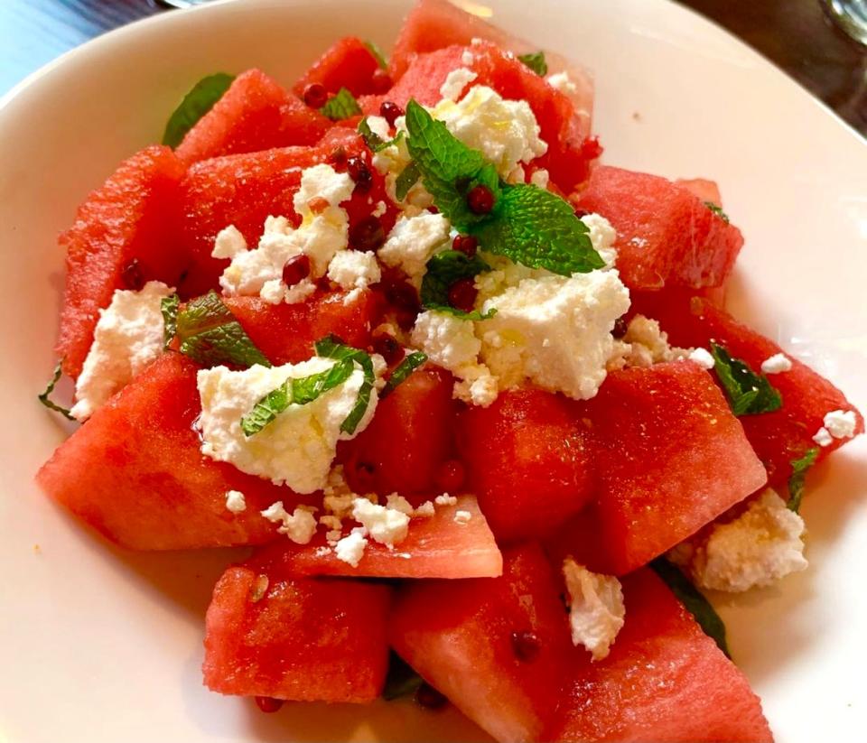 Watermelon salad with mint and feta. Farmers & Chefs'  John Lekic grows some of his own greens and herbs in a vertical container garden system.