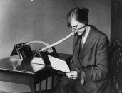 27th February 1919: A woman wearing a flu mask during the flu epidemic which followed the First World War. (Photo by Topical Press Agency/Getty Images)