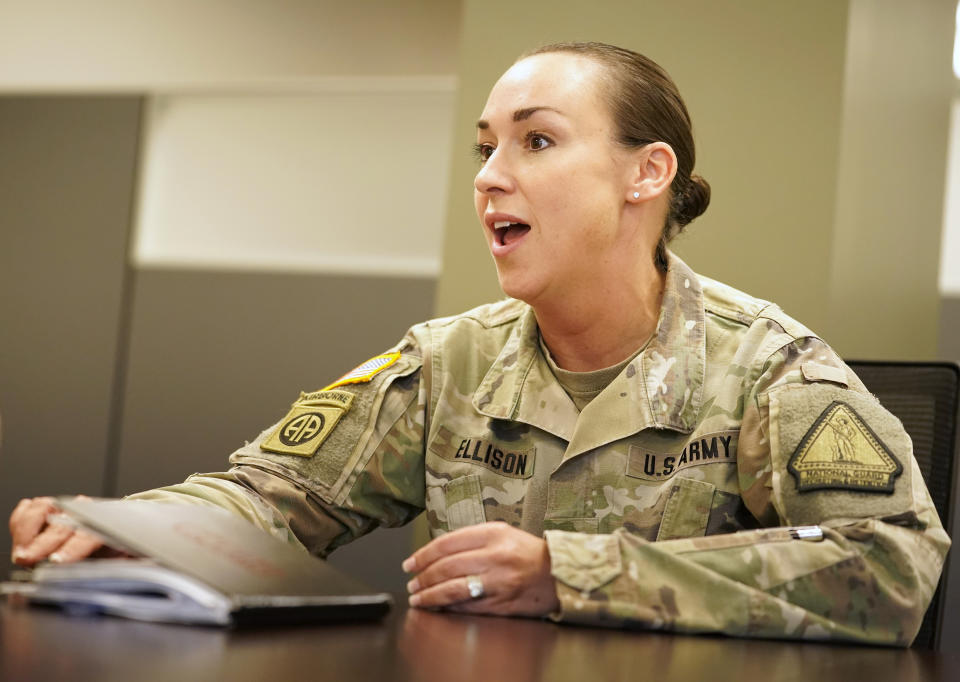 The U.S. Army National Guard recruitment chief Lt. Col. Amber Ellison speaks during an interview with The Associated Press, Thursday, April 21, 2022 in Washington. In March the local guard opened its first proper recruiting office in the city since 2010. The commander, Maj. Gen. Sherrie McCandless, describes the move as a new push for visibility and an emphasis on the guard’s local connections at a time when many residents might be ripe for recruitment. (AP Photo/Mariam Zuhaib)