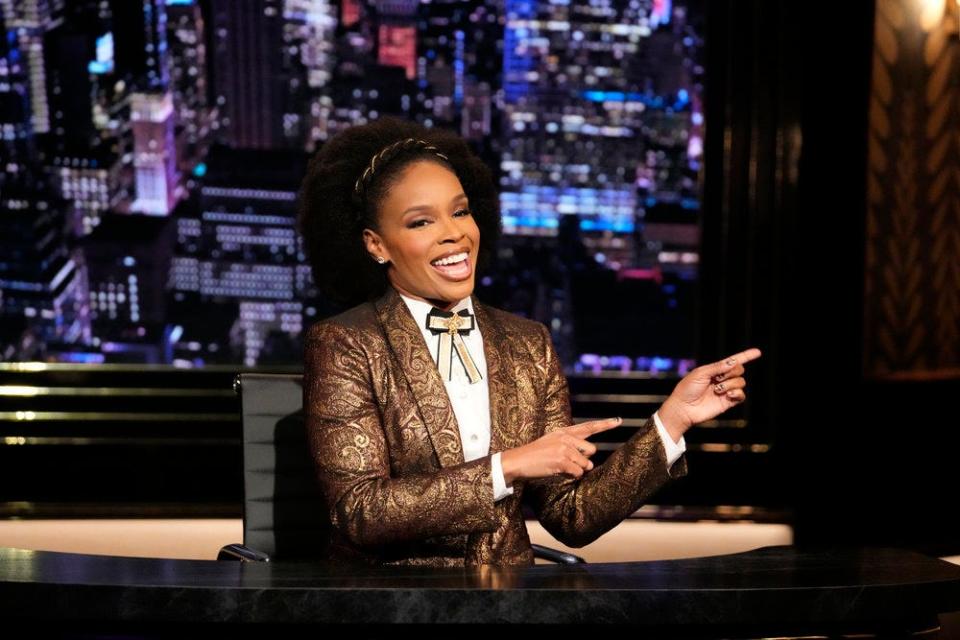 Amber Ruffin wears a wide grin during the filming of her eponymous talk show.