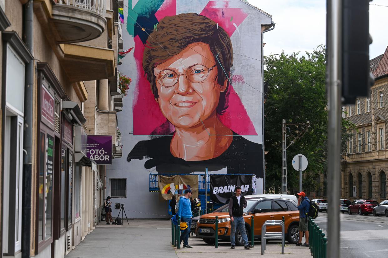 A portrait of Hungarian-American scientist Katalin Kariko by 'The colorful city' artist group is seen on a firewall in Budapest on August 28. 