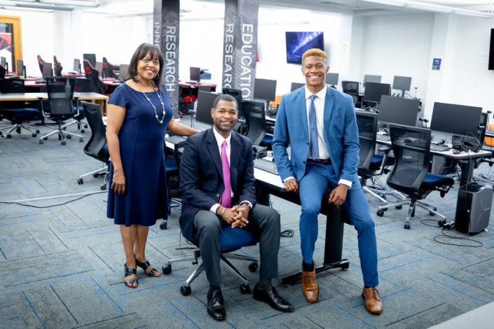 J.J. Townsend, right, with Dr. Deborah Dent, Chief Information Officer at Jackson State University and Dr. Wilbur Walters, Dean at JSU at a computer lab in the campus library.