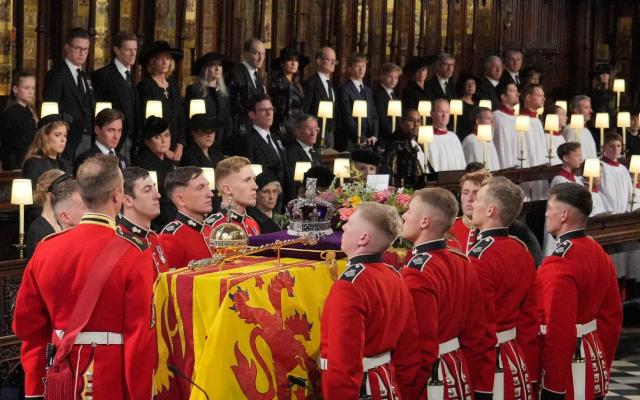 Coffin of the late Queen is carried by pallbearers from 1st Battalion Grenadier Guards at St George's Chapel in Windsor Castle - Getty Images