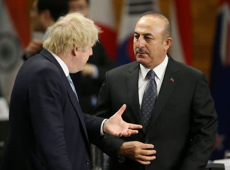 Britian's Secretary of State for Foreign Affairs Boris Johnson speaks with Turkey's Minister of Foreign Affairs Mevlut Cavusoglu during the Foreign Ministers’ Meeting on Security and Stability on the Korean Peninsula in Vancouver, British Columbia, Canada January 16, 2018. REUTERS/Ben Nelms