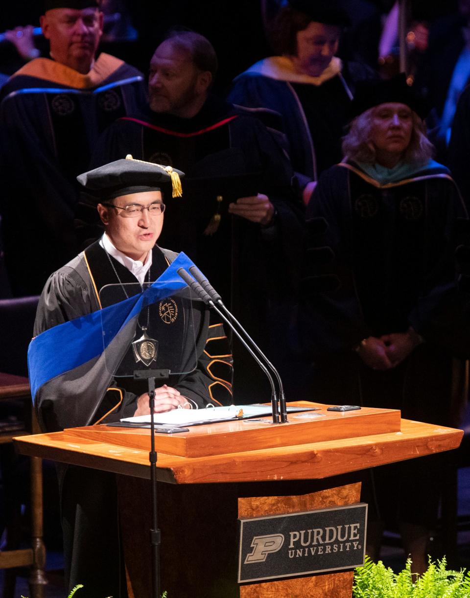 Purdue President Mung Chiang speaks during a graduation ceremony, Friday, May 12, 2023, at Purdue University’s Elliott Hall in West Lafayette, Ind.