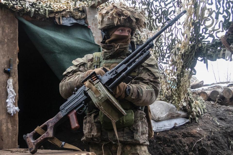 File photo: An Ukrainian soldier stands at the line of separation from pro-Russian rebels, Donetsk region, Ukraine, 10 January 2022 (AP)