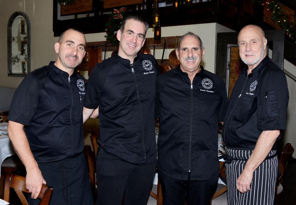 Iconic American chef Larry Forgione (from right) poses for a portrait with Café Chardonnay owner Frank Eucalitto and sons Bryan and Marc Forgione during the 2022 Palm Beach Food & Wine Festival.