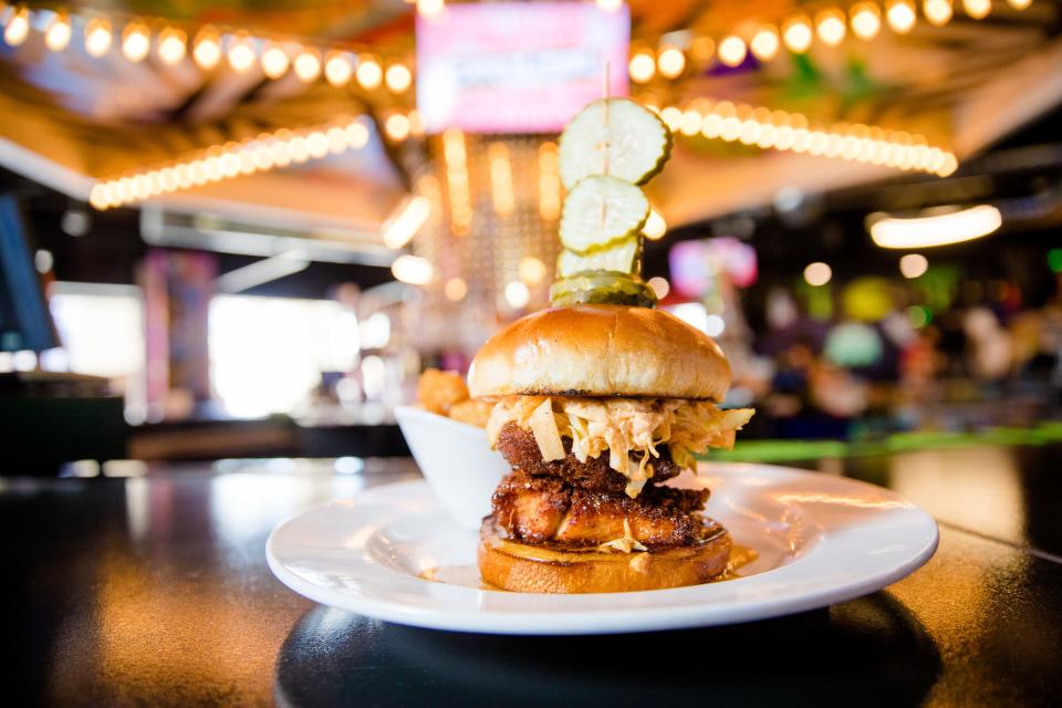 Carousel Arcade Bar has several fair-inspired treats including finger foods, burgers, cotton candy, cocktails and milkshakes topped with cake.