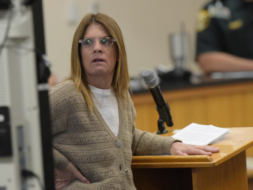 Jodi Bruce, sister of murder victim Michelle Mishcon, comments on a photo of Michelle projected to the court during a court proceeding before Circuit Judge Sherwood Bauer at the Martin County Courthouse on Monday, Nov. 28, 2022 in Stuart, Fla.