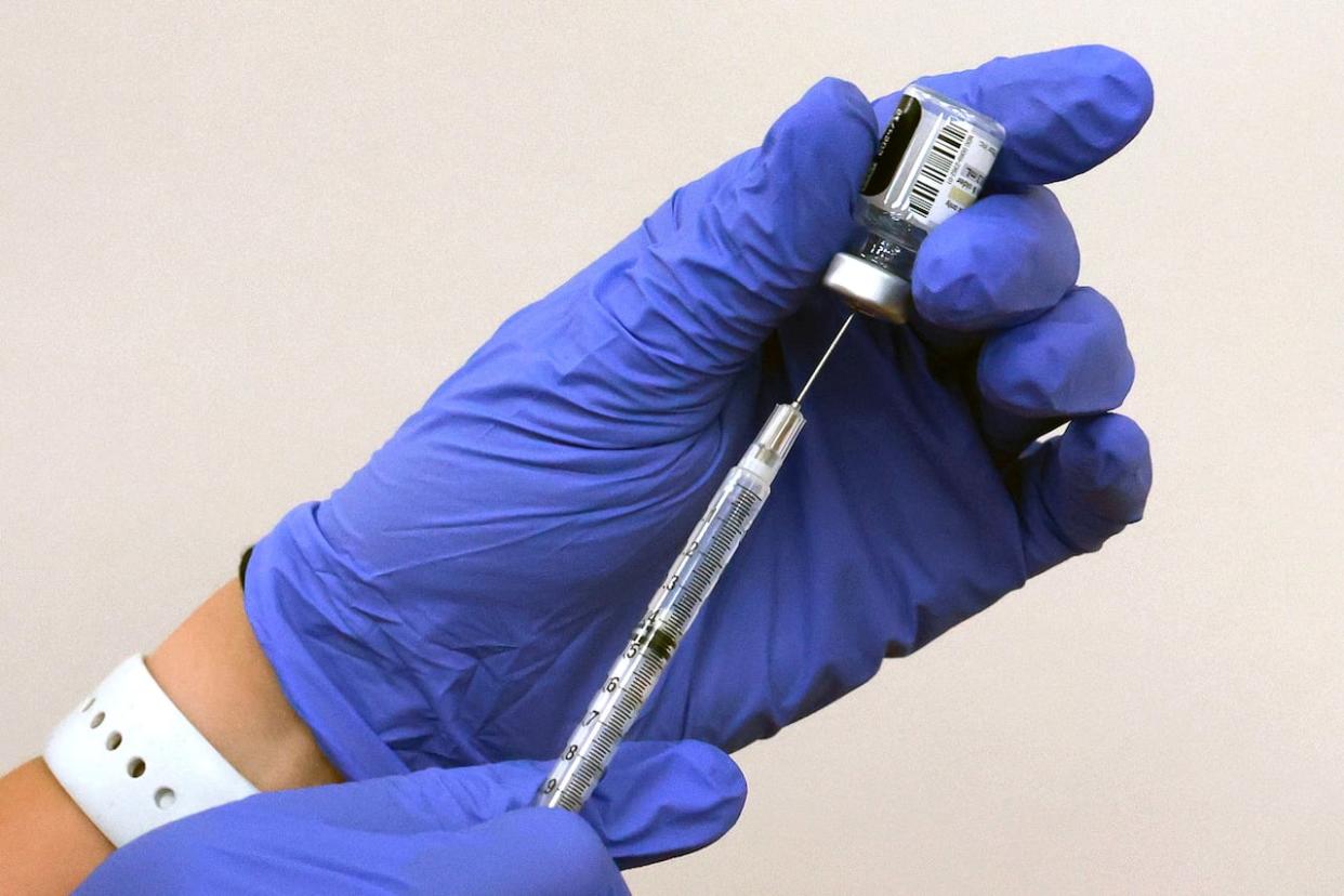 A total of 2,086,714 COVID-19 vaccine doses were administered in New Brunswick between Dec. 14, 2020, and Aug. 26, 2023, according to the Department of Health. From that total, there were 1,170 adverse events, 154 of them serious, based on the new definition.  (Joe Burbank/Orlando Sentinel/The Associated Press - image credit)