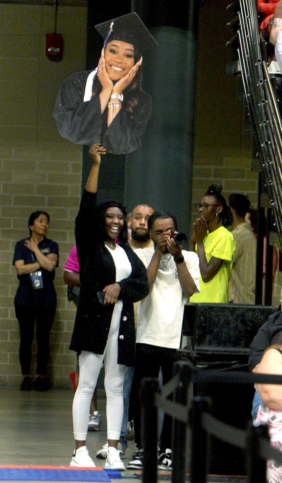 Daizha Griffin of Springfield cheers on her graduating little sister Chri'chauna Scott during the University of Illinois Springfield Commencement ceremony Saturday, May 13, 2023.