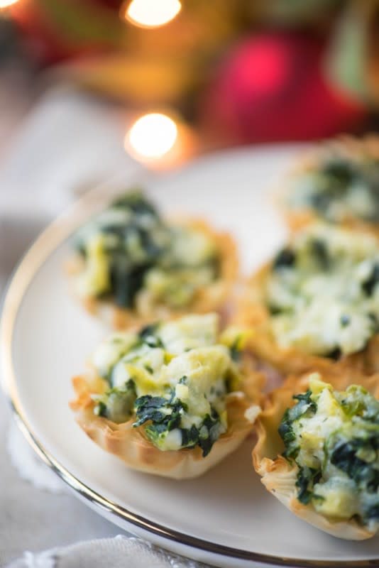 <p>Go Go Go Gourmet</p><p>The next time you make spinach artichoke dip, add a dollop to some phyllo cups to make these baked spinach artichoke dip cups!</p><p><strong>Get the recipe: <a href="https://www.gogogogourmet.com/baked-spinach-artichoke-dip-phyllo-cups/" rel="nofollow noopener" target="_blank" data-ylk="slk:Mini Phyllo Quiche Cups;elm:context_link;itc:0;sec:content-canvas" class="link rapid-noclick-resp"><em>Mini Phyllo Quiche Cups</em></a></strong></p>