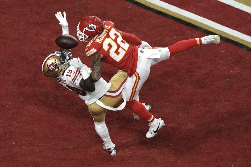 Kansas City Chiefs cornerback Trent McDuffie (22) breaks up a pass intended for San Francisco 49ers wide receiver Deebo Samuel (19) during the first half of the NFL Super Bowl 58 football game Sunday, Feb. 11, 2024, in Las Vegas. (AP Photo/Charlie Riedel)